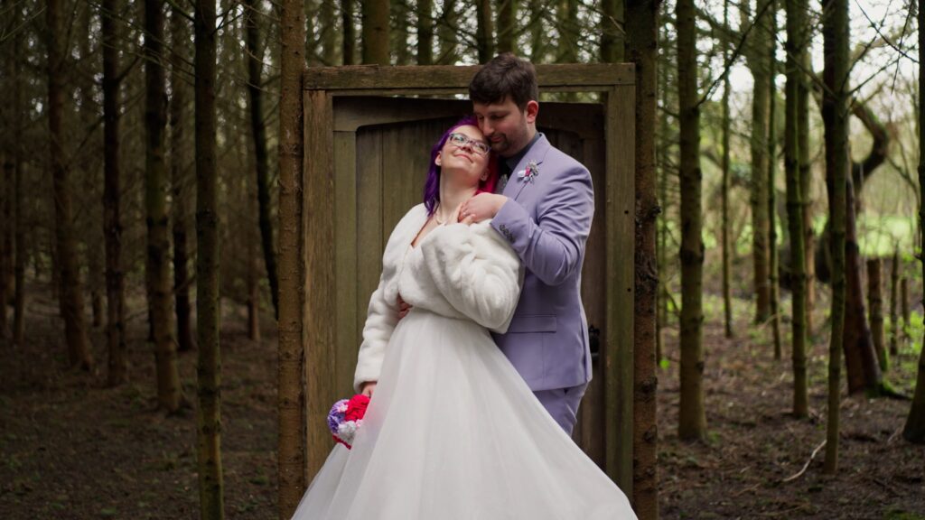 Bride & Groom in front of a mysterious door in the middle of the woods.