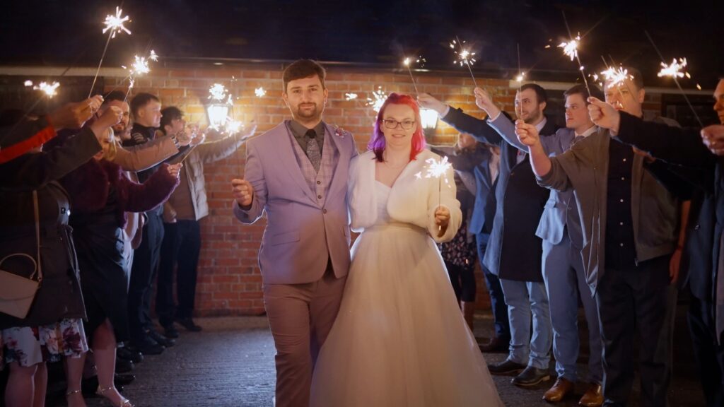 Wedding couple sparkler exit shot