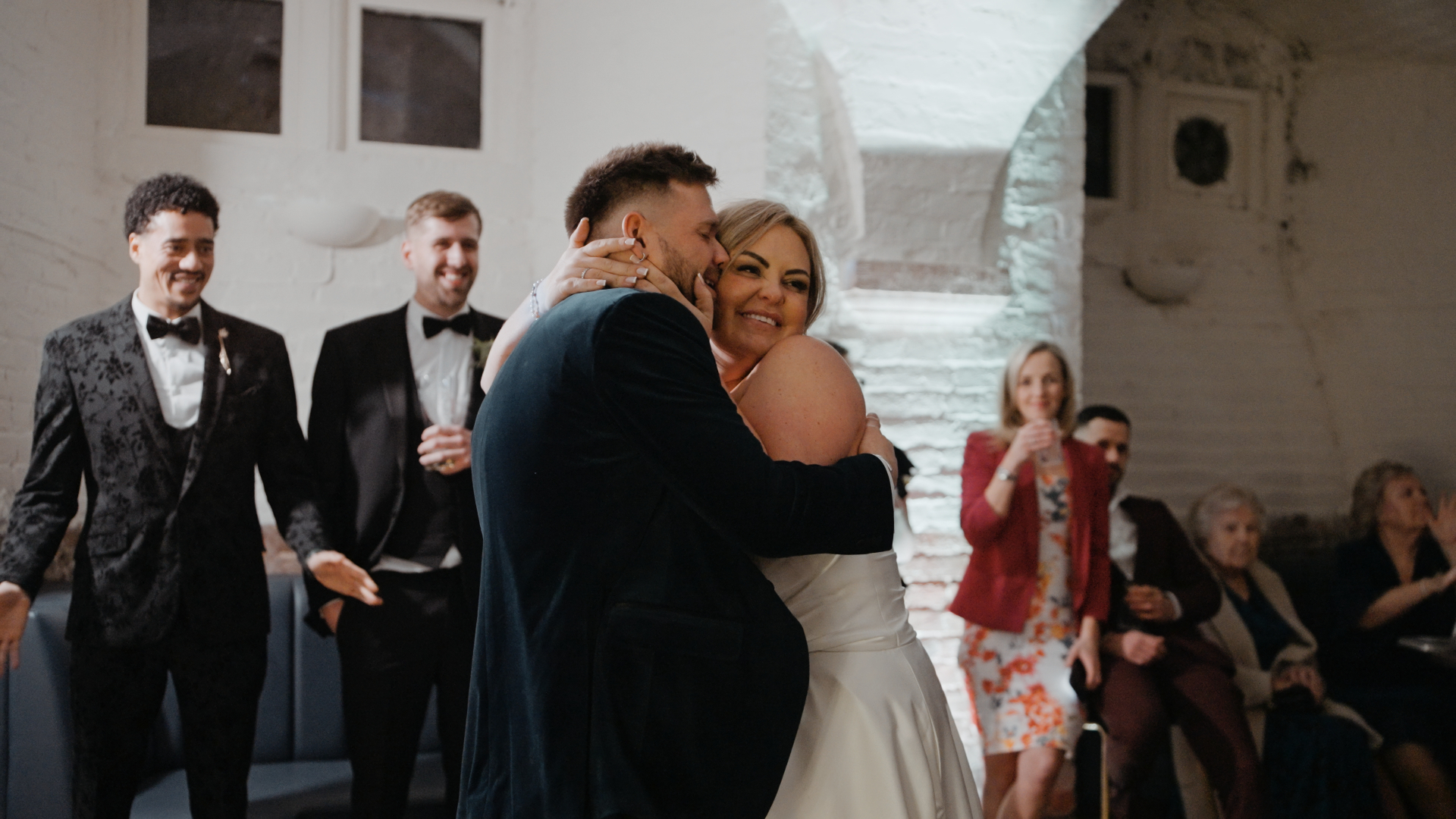 Hannah & Joe’s romantic first dance at Crowcombe Court, with a packed dance floor in the background.