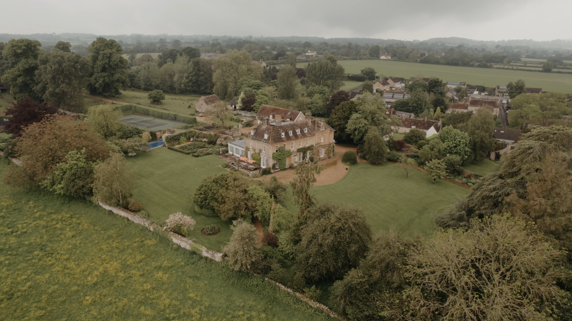Aerial drone footage of the wedding venue, showcasing the stunning surroundings and capturing the essence of the celebration, a trending approach in 2025 wedding videography