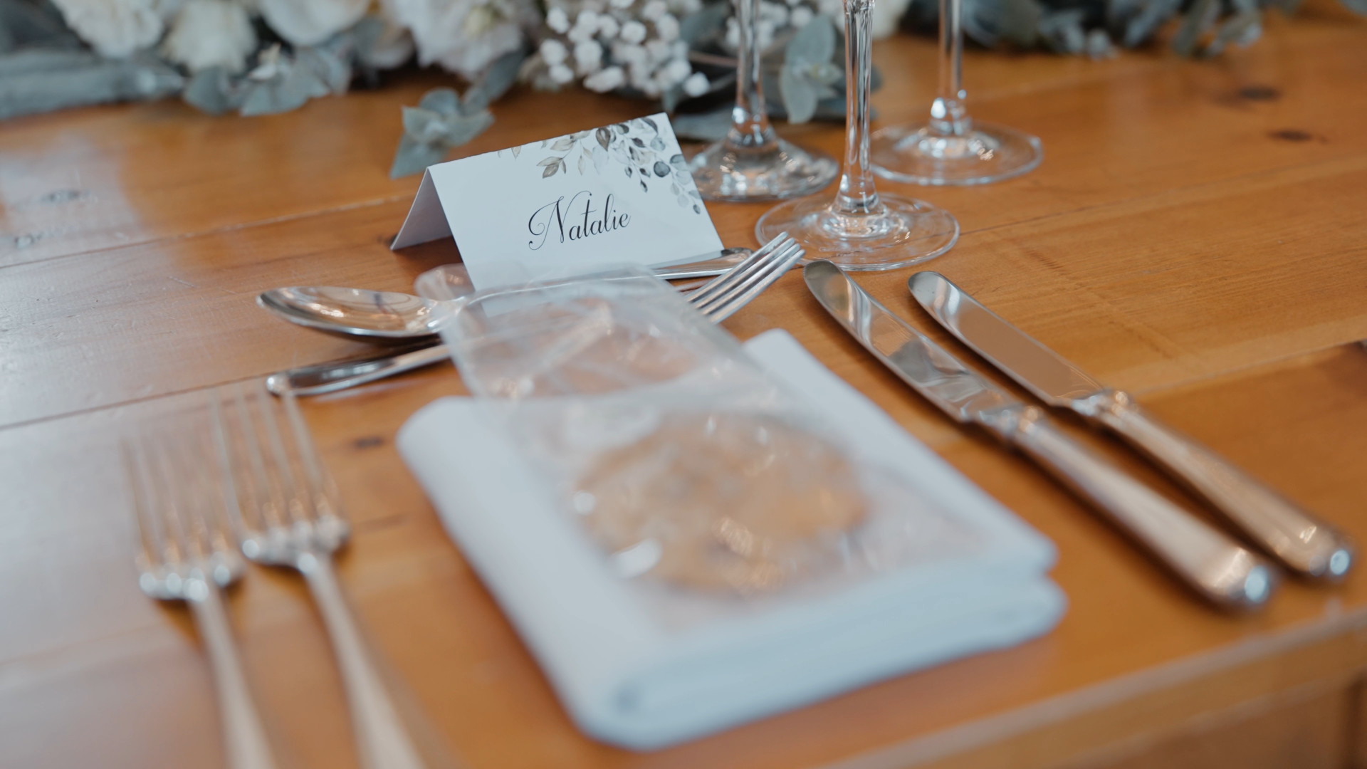 Elegant wedding reception table setup with name card in front of plate — a beautiful detail to capture in your wedding video by a Somerset wedding videographer