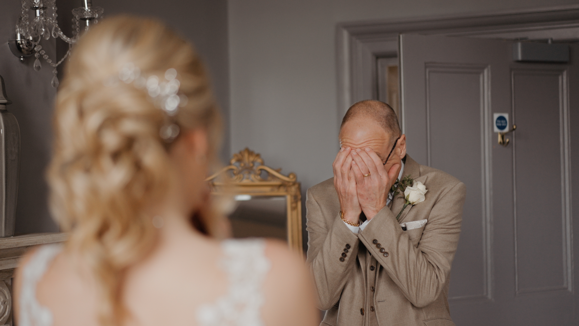 Emotional first look with father crying and covering his face — a powerful moment to capture in your wedding video by a Somerset wedding videographer