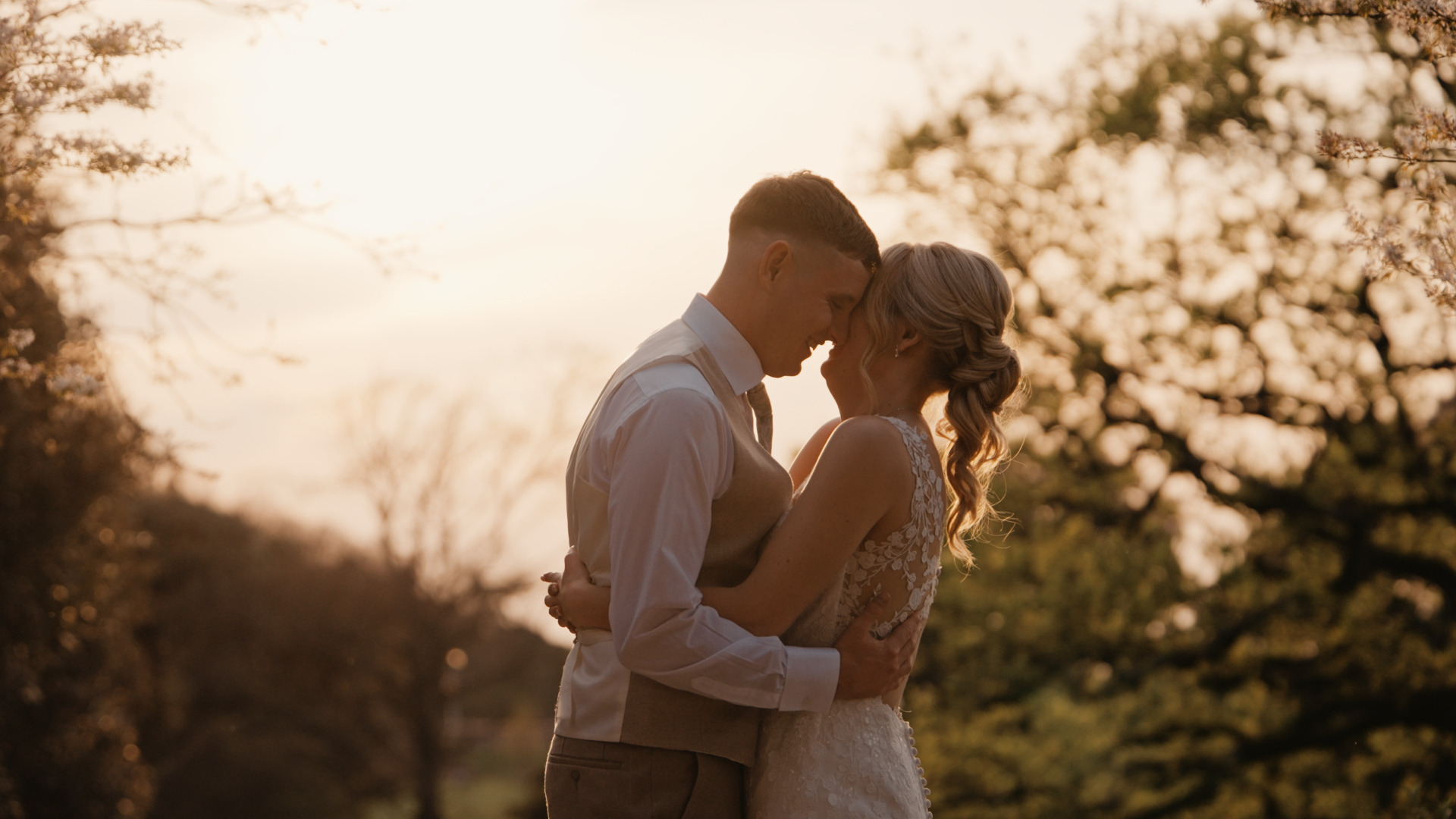 Bride and groom pose romantically during golden hour, perfect for autumn wedding styling tips.