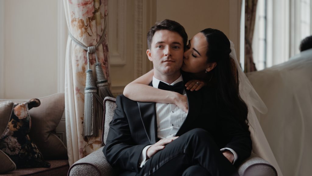 Bride and groom share an intimate kiss as newlyweds.