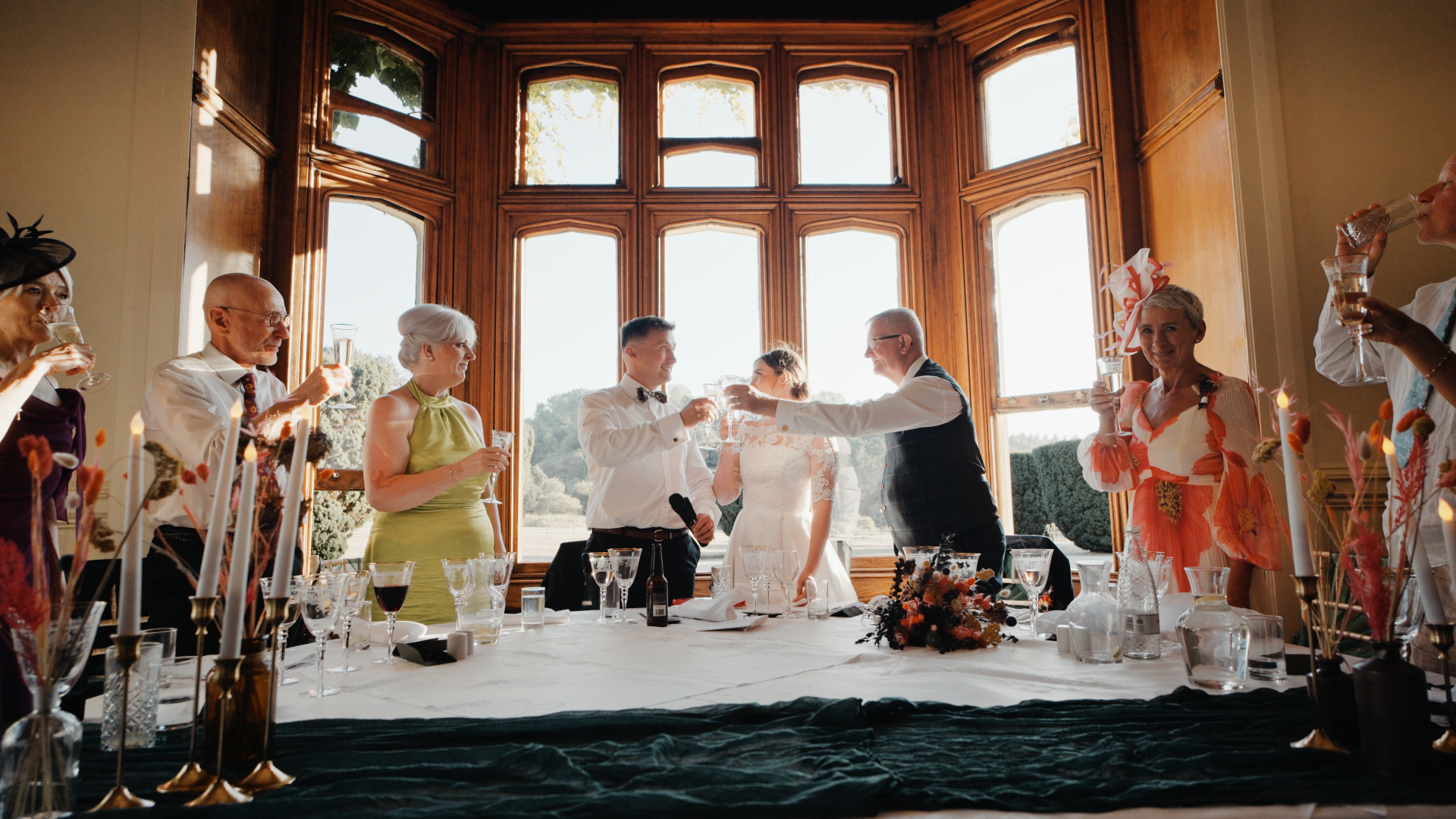 The bride and groom raise a toast with family during heartfelt speeches at their Somerset reception.