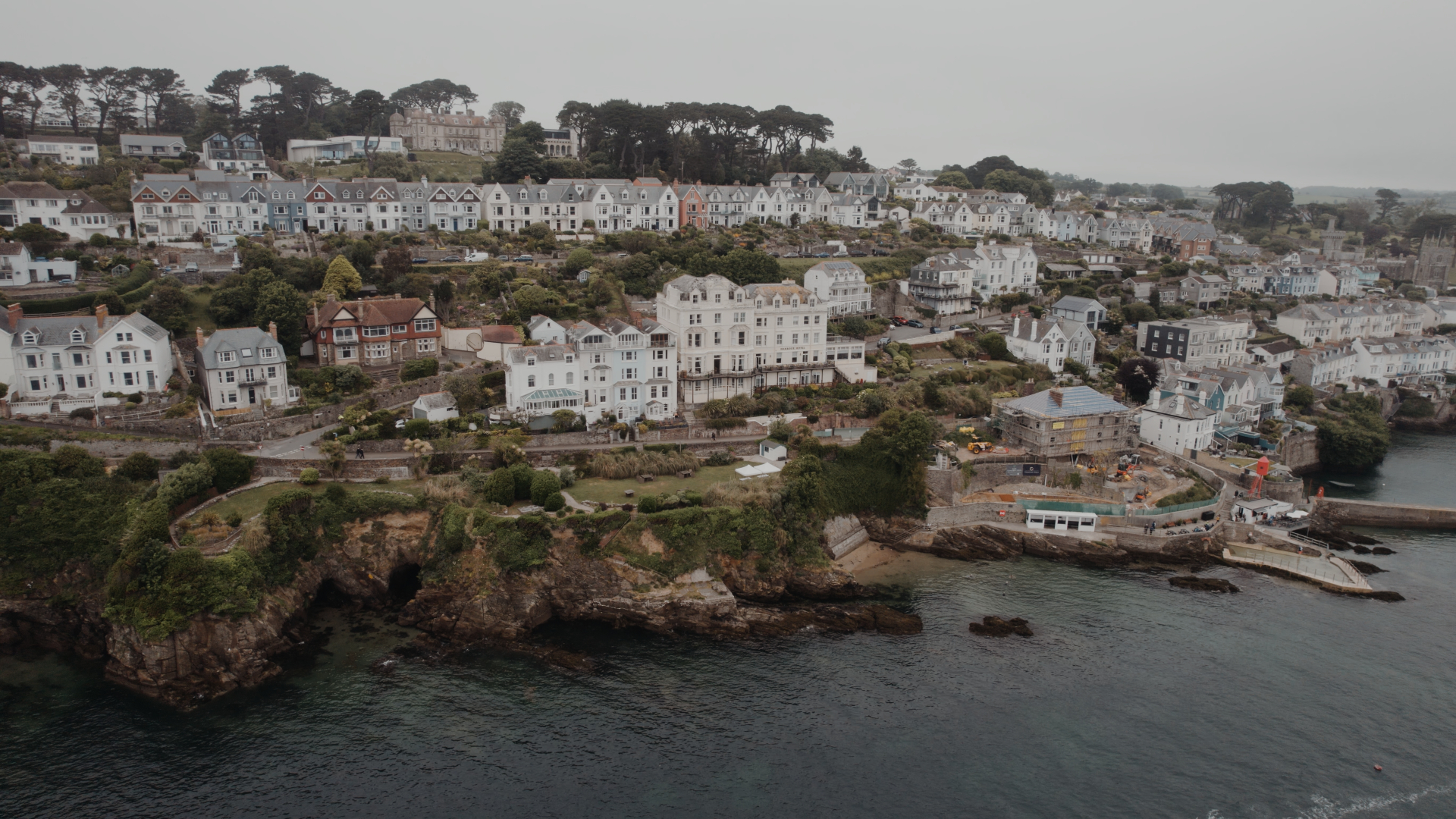 Aerial view of Harbour Hotel Fowey set against the Cornish coastline and town.