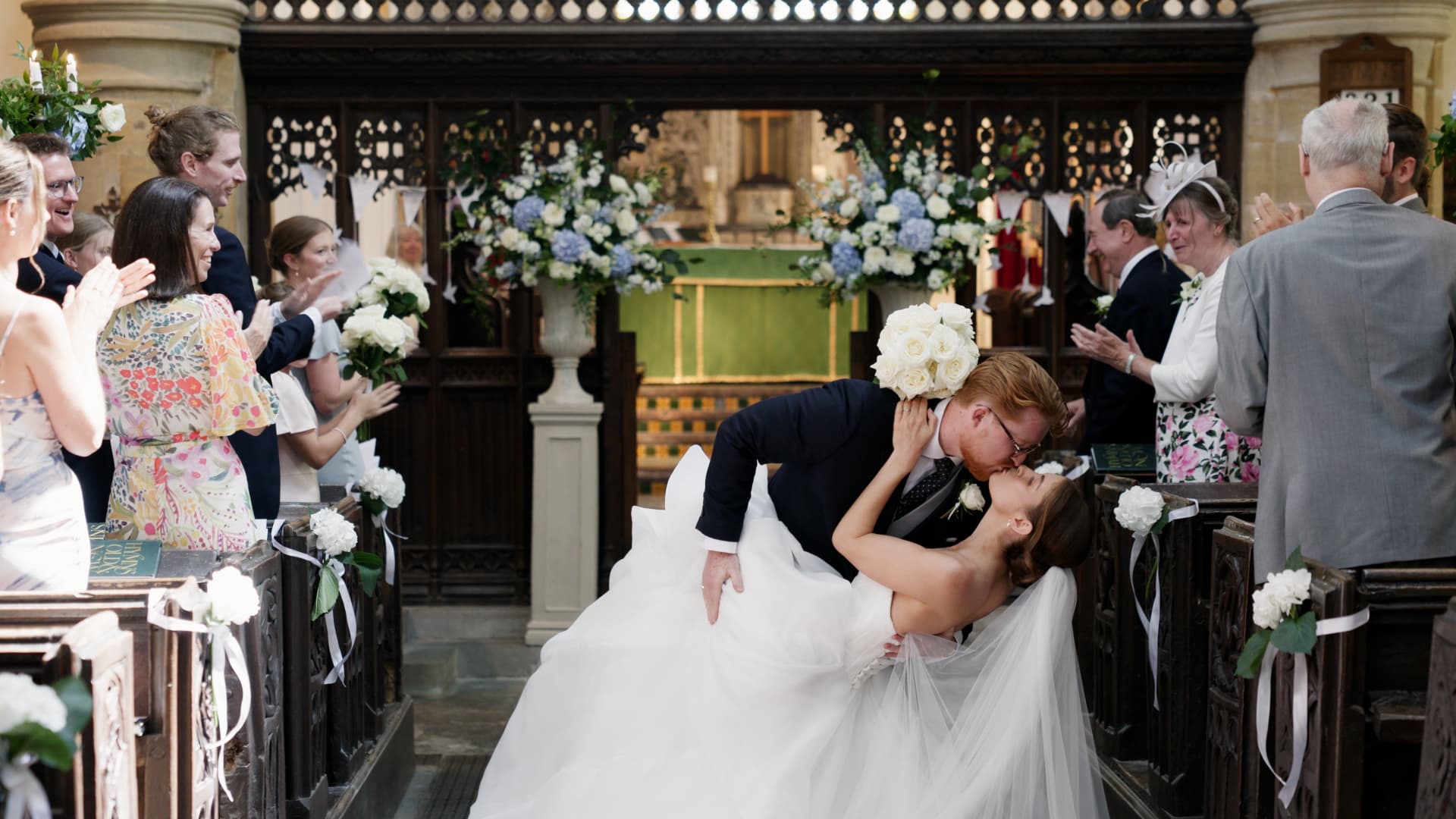Bride and groom share a romantic kiss after their ceremony before heading to Crowcombe Court for their reception.
