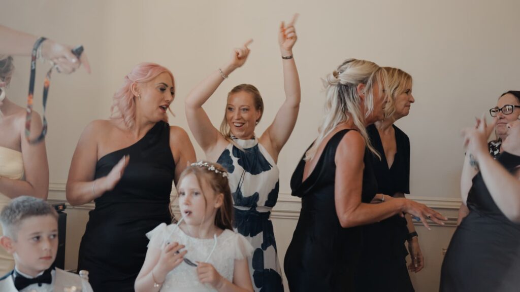 Guests dance and celebrate during the reception at a Somerset wedding, filled with laughter and joyful energy.