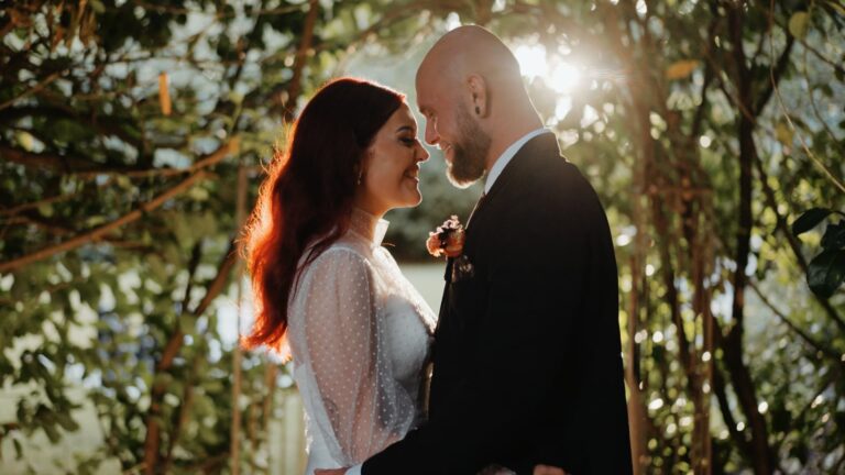 Bride and groom sharing an intimate sunset moment in the gardens of Pendrell Hall.