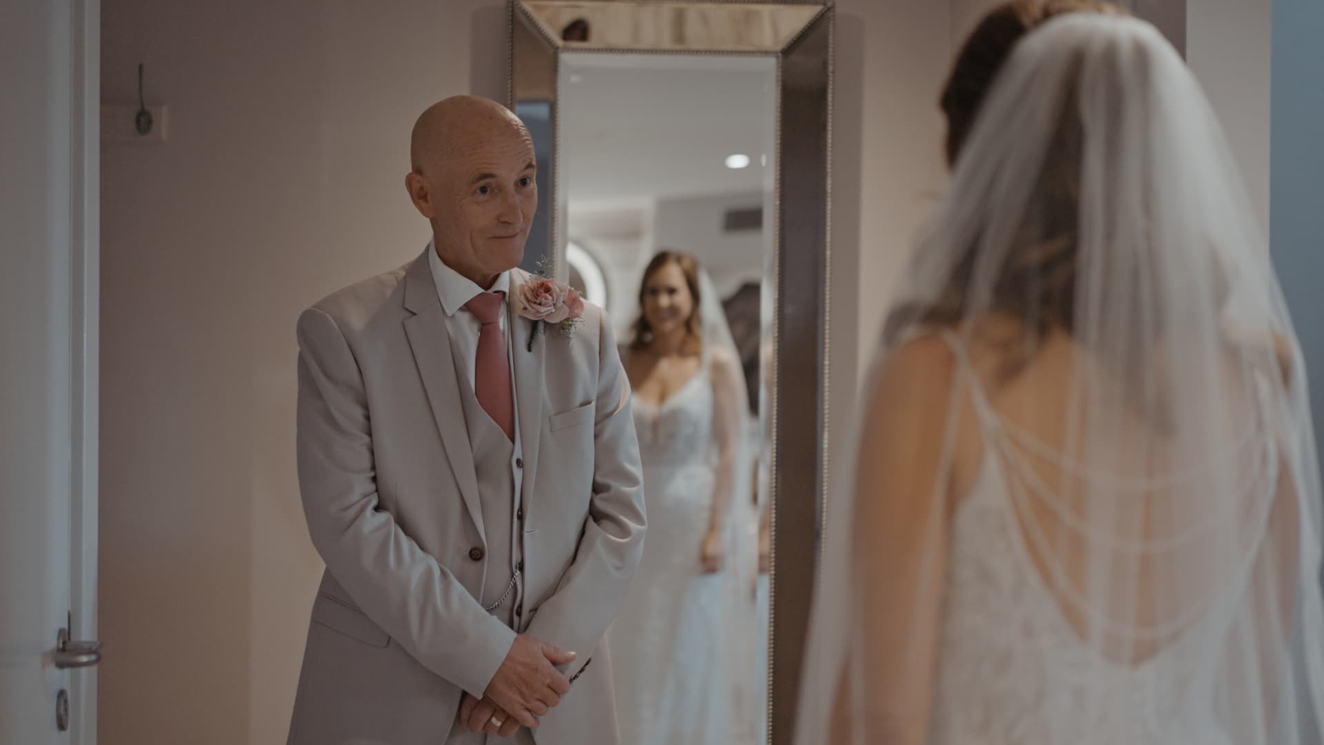 Father seeing bride during emotional first look captured at a Cadbury House Wedding.
