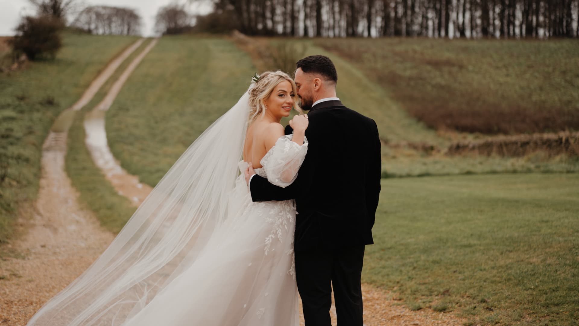 Romantic countryside portrait of the newlyweds captured by a Somerset wedding videographer as part of a documentary wedding film