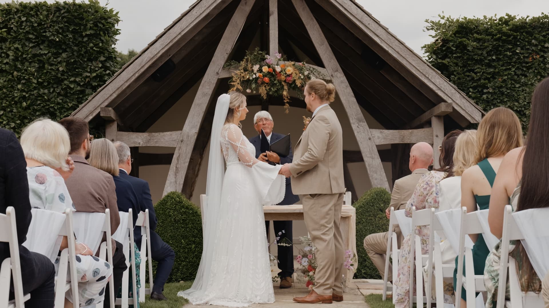 Outdoor wedding ceremony at Kingscote Barn in the Cotswolds, beautifully captured by a wedding filmmaker with a relaxed, documentary approach to Southwest wedding videography.
