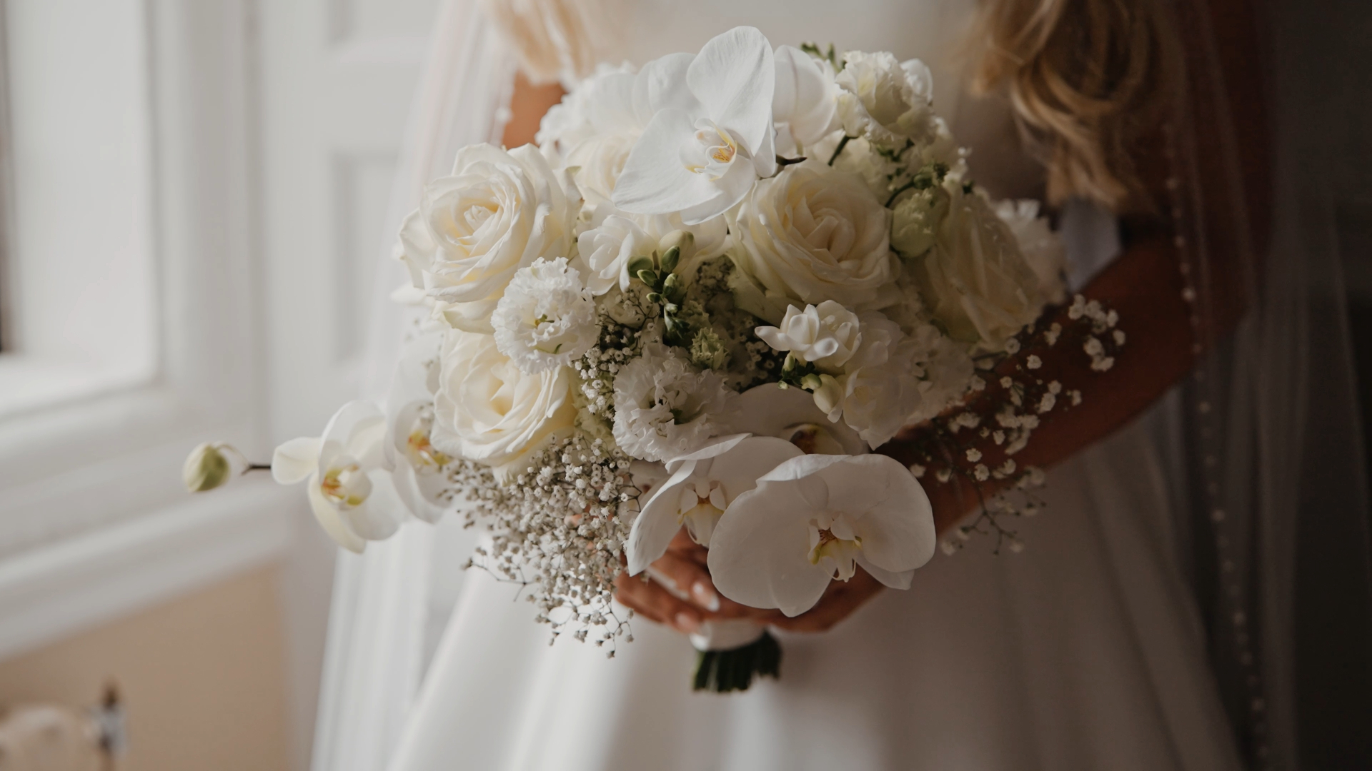Close-up of elegant bridal bouquet at Clearwell Castle in the Forest of Dean, captured in refined documentary wedding videography with a cinematic luxury wedding film feel