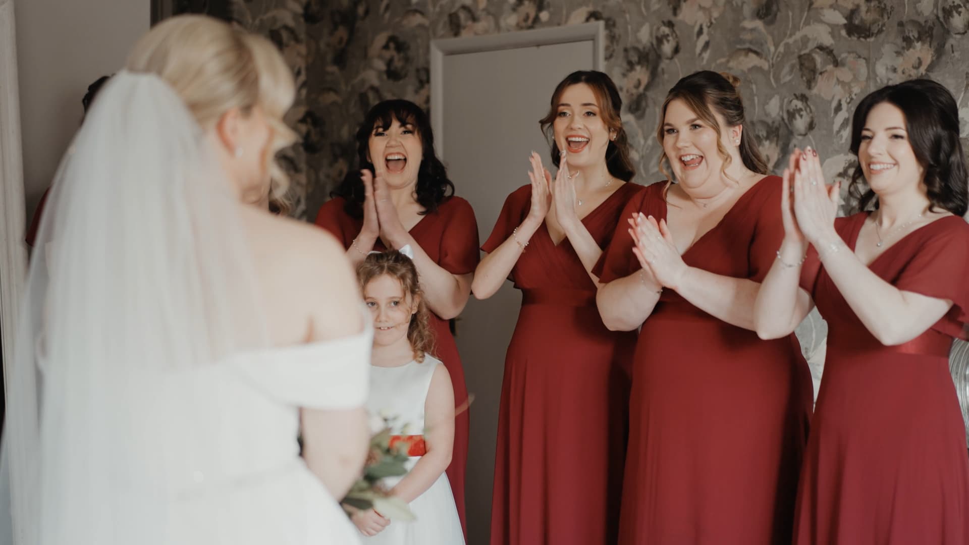 Emotional bridesmaids reaction during bridal prep at St Audries Park wedding captured through natural wedding videography moments