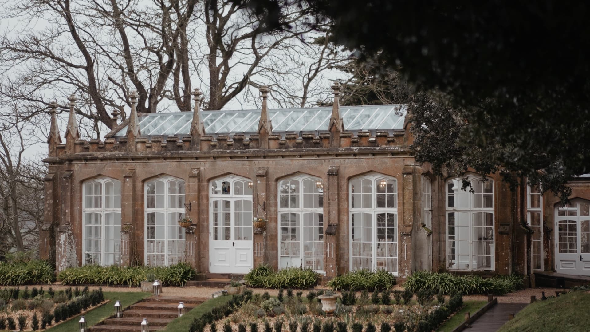 St Audries Park wedding orangery ceremony venue in Somerset with elegant glass windows and landscaped gardens