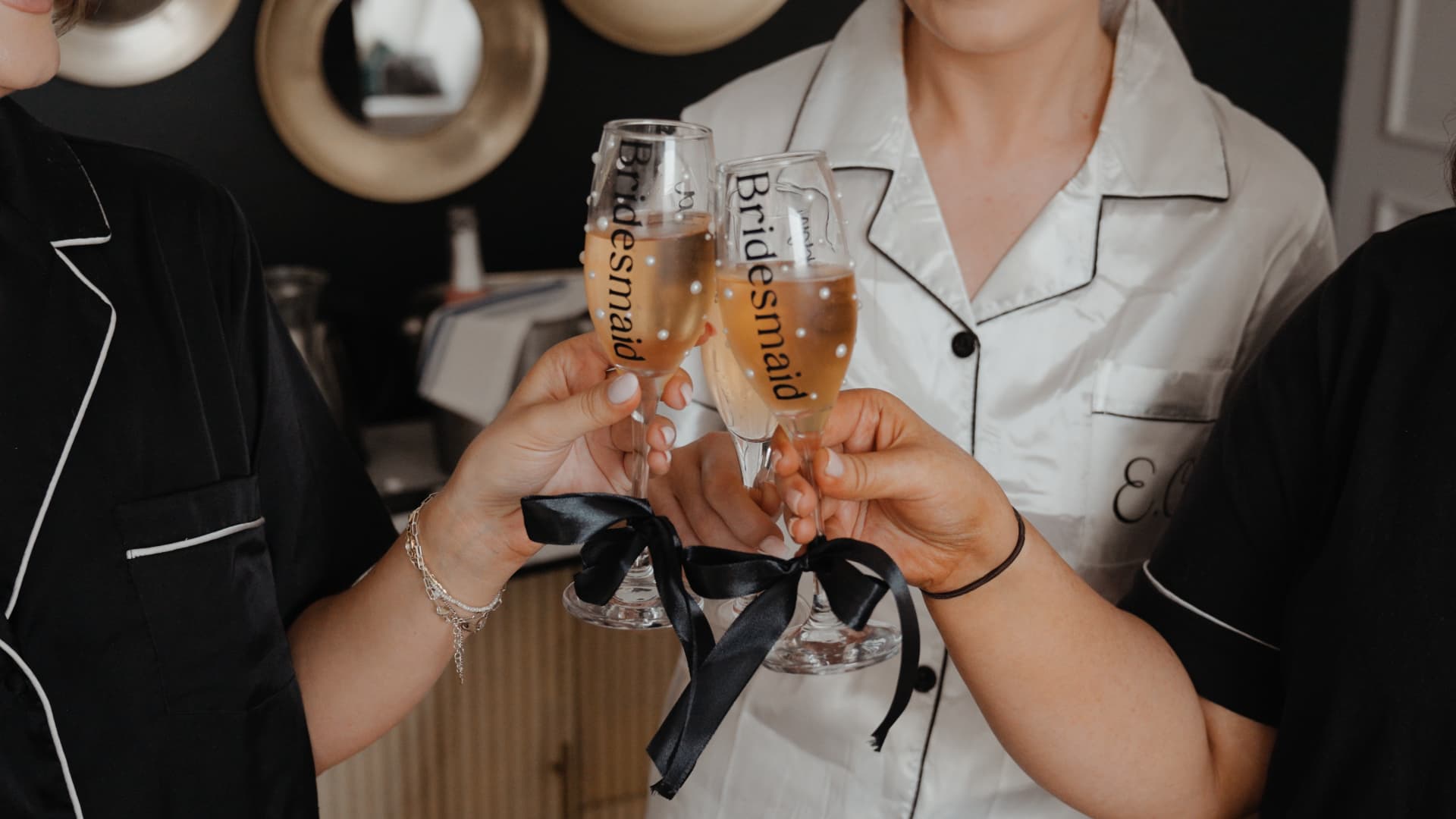 Bridesmaids toasting champagne during bridal prep at Llanerch Vineyard, South Wales, captured in luxury documentary style wedding videography with a client love moment