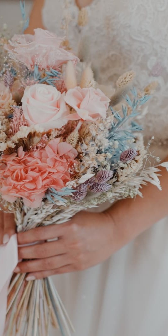 Close-up of bridal bouquet at Holmewood Hall, Cambridgeshire, captured by a wedding filmmaker specialising in wedding videography and natural storytelling
