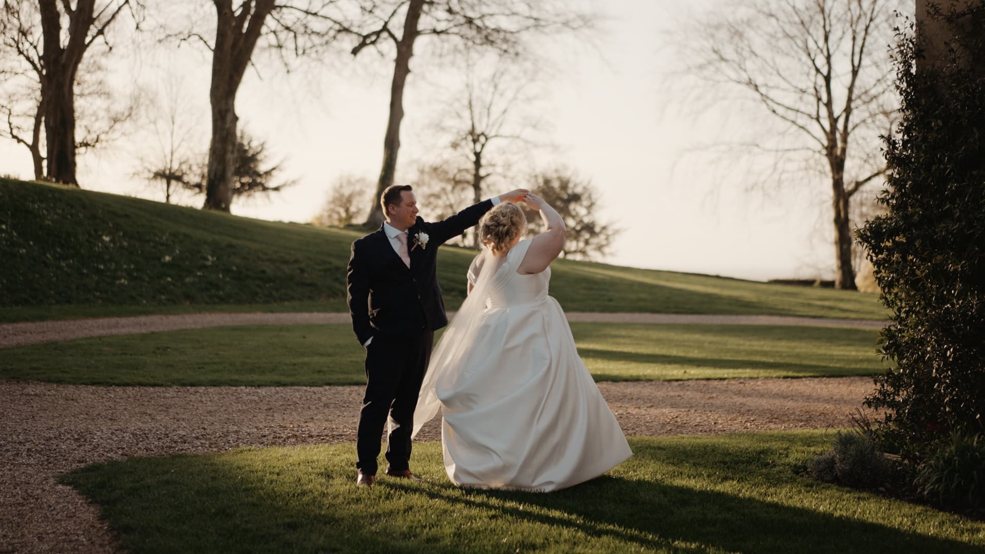 Bride and groom enjoying sunset portraits at Coombe Lodge Blagdon, a stunning Somerset wedding venue featured in wedding videography.