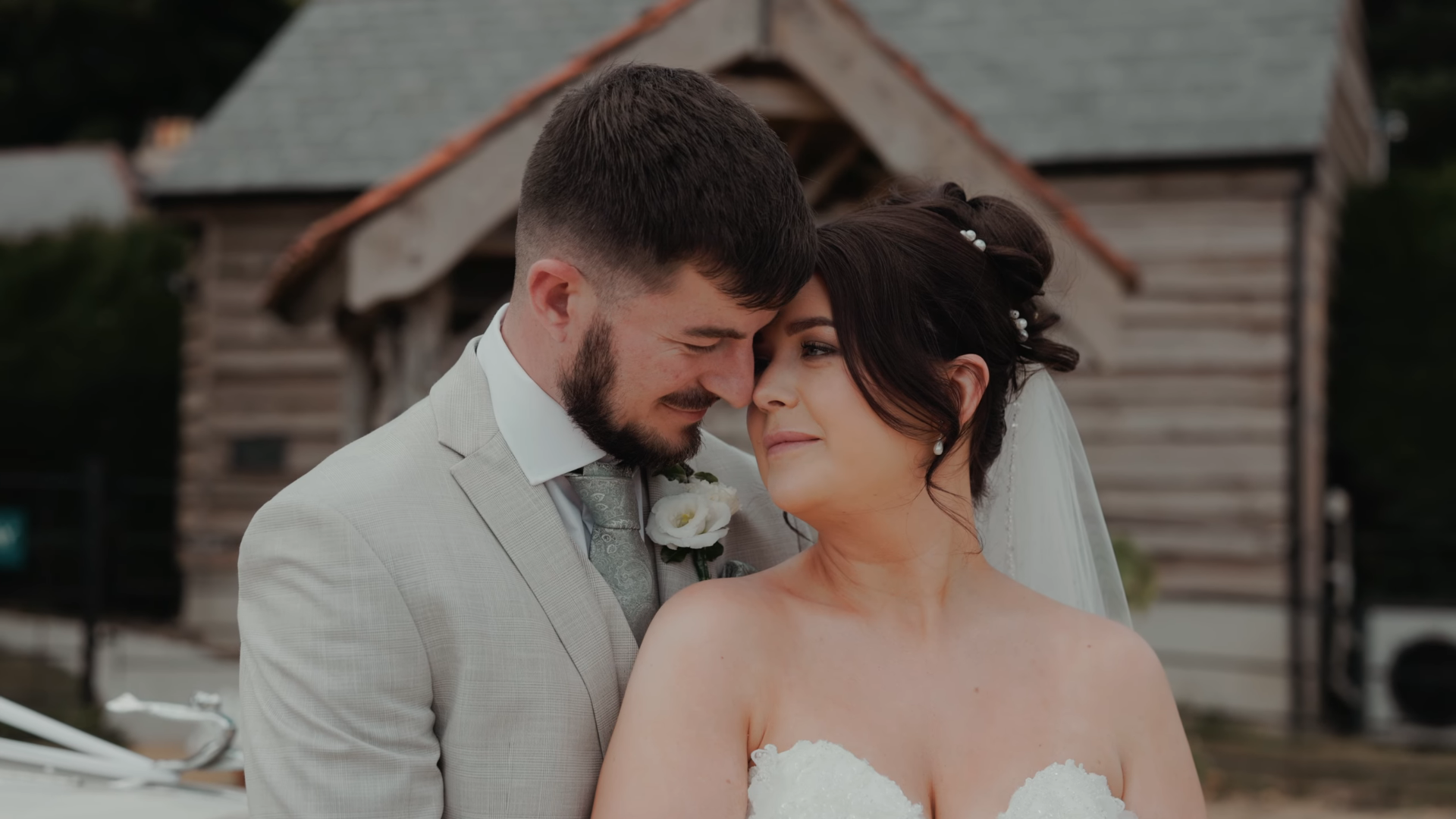 Bride and groom share a tender moment, filmed by a Somerset wedding videographer and filmmaker